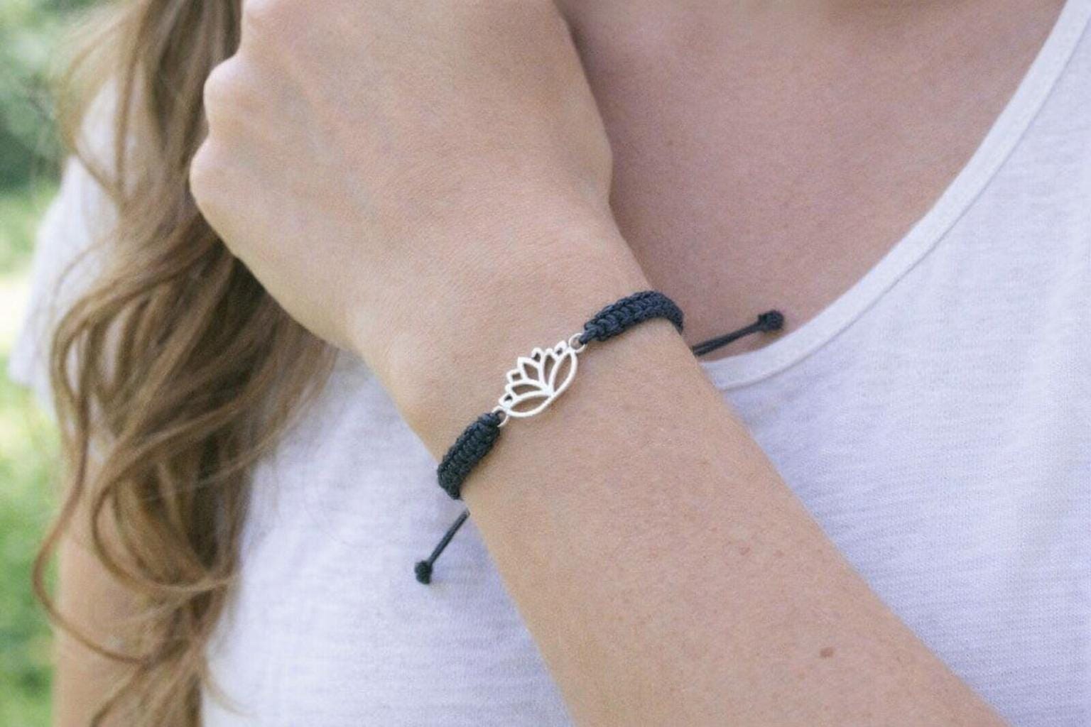 Adjustable lotus friendship bracelet worn on wrist boho style