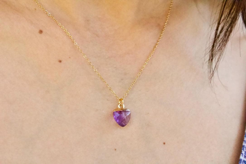 Amethyst gemstone necklace worn by woman