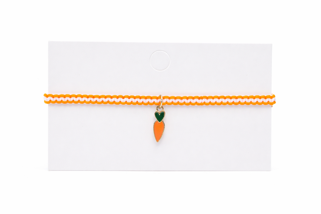 Carrot-shaped charm on a thin orange ribbon against a white background