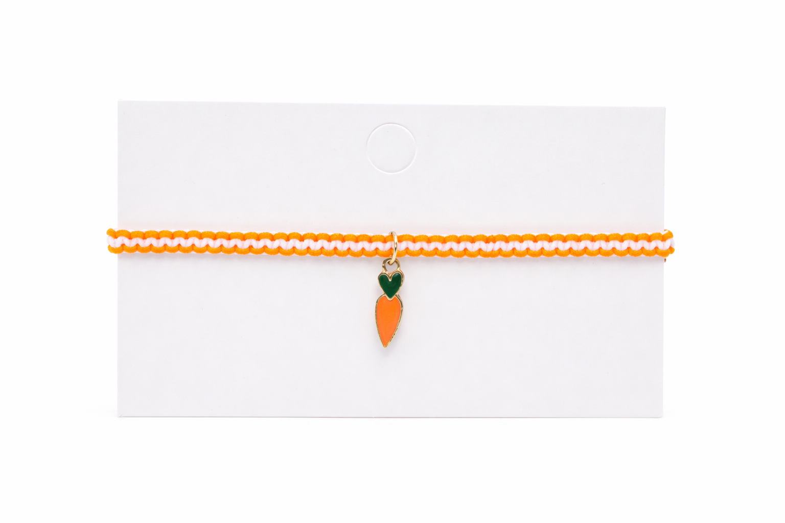 Carrot-shaped charm on a thin orange ribbon against a white background
