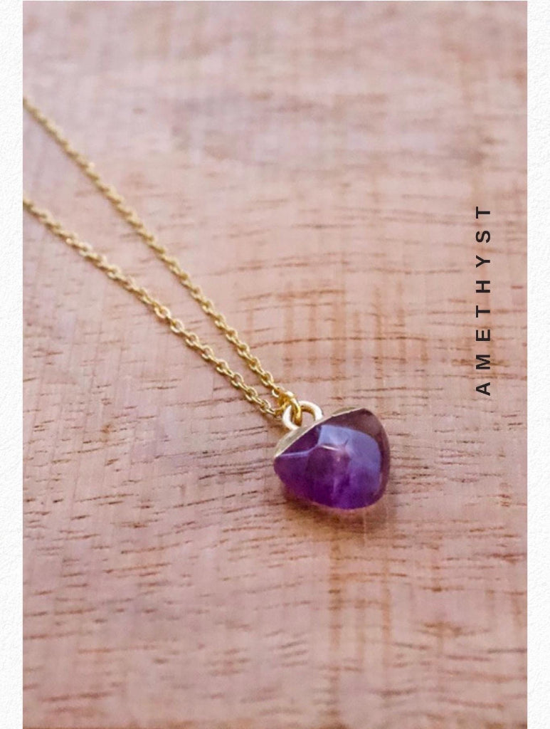 Close-up of amethyst crystal pendant necklace