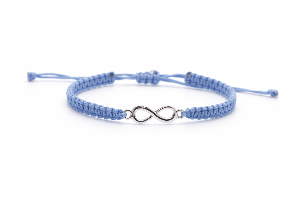 Close-up of infinity charm on handmade macrame bracelet by Chaya