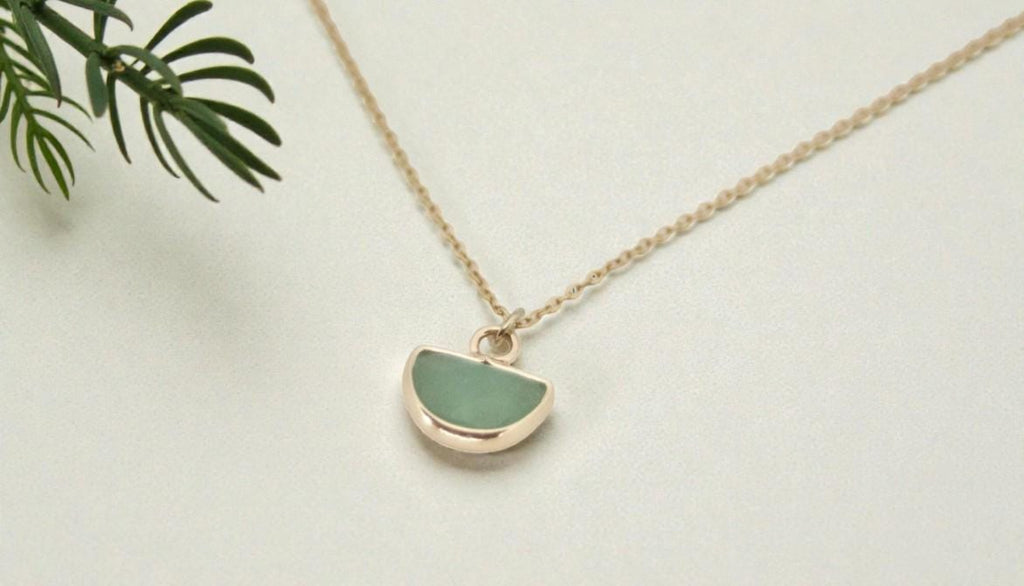 Green aventurine half moon necklace in gold plated setting on 16 inch chain