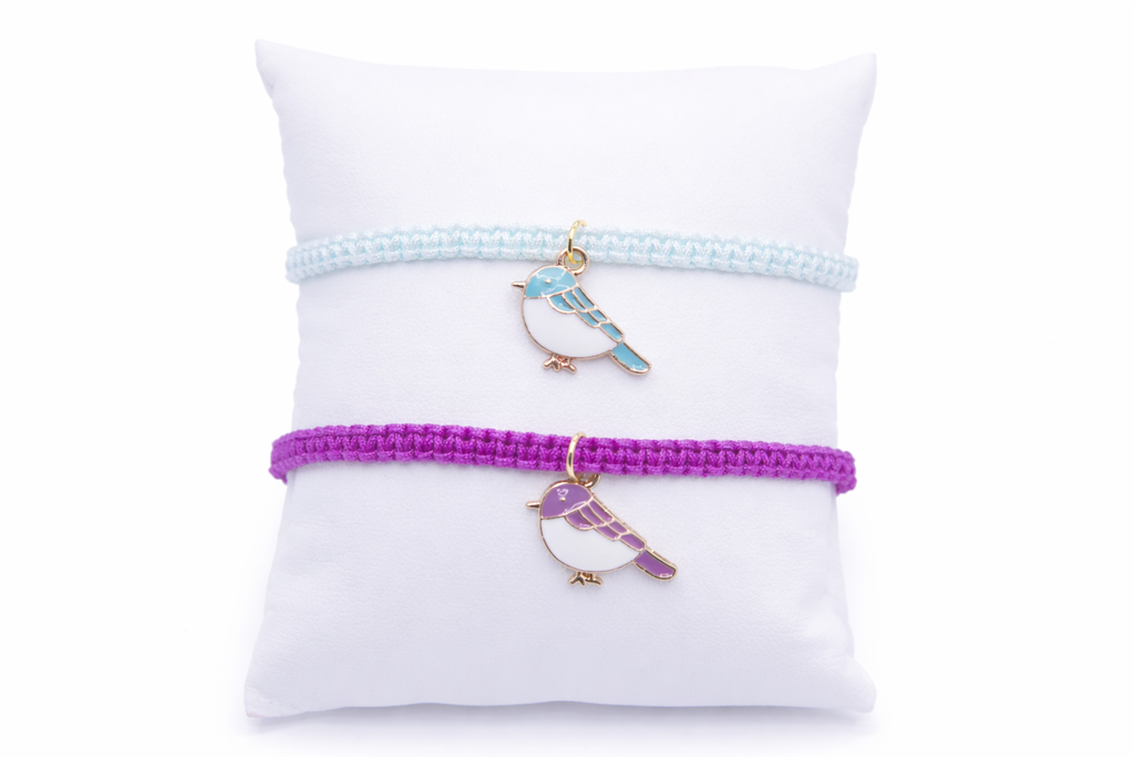 Handmade bird charm adjustable bracelet in purple and green cord, friendship and good luck jewelry