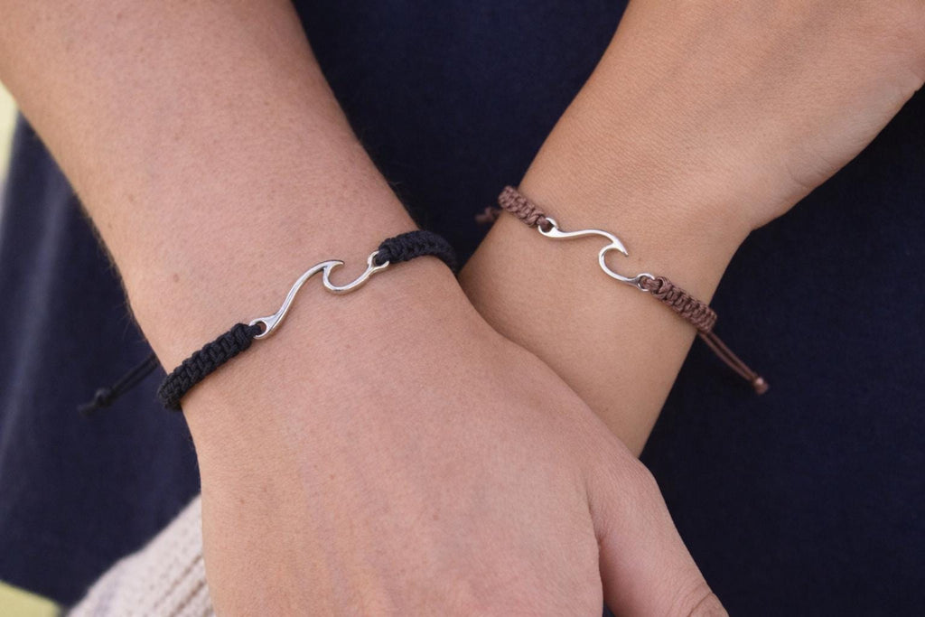 Ocean wave charm bracelet worn on wrist