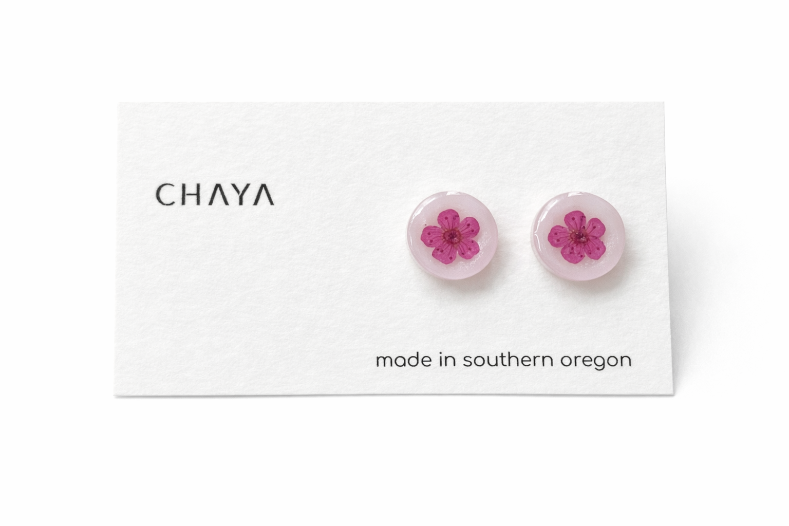 Pair of pink flower earrings on a Chaya branded card with 'made in southern Oregon' text.