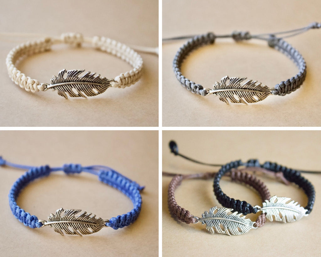 Four feather-themed bracelets in different colors on a beige background
