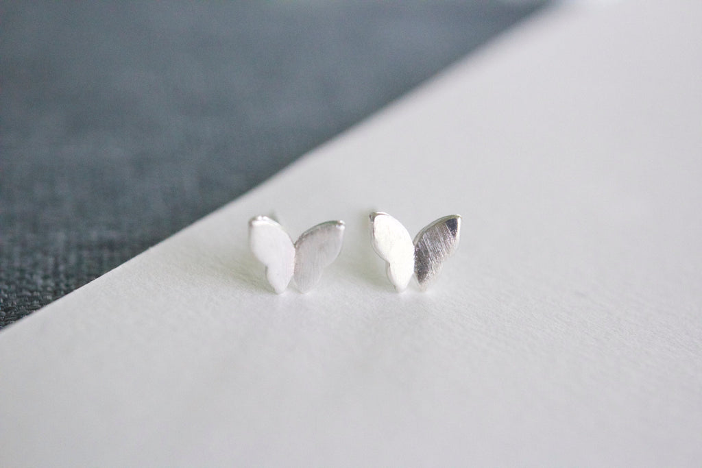 Sterling silver butterfly stud earrings for sensitive ears on white background