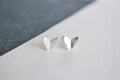 Sterling silver butterfly stud earrings for sensitive ears on white background