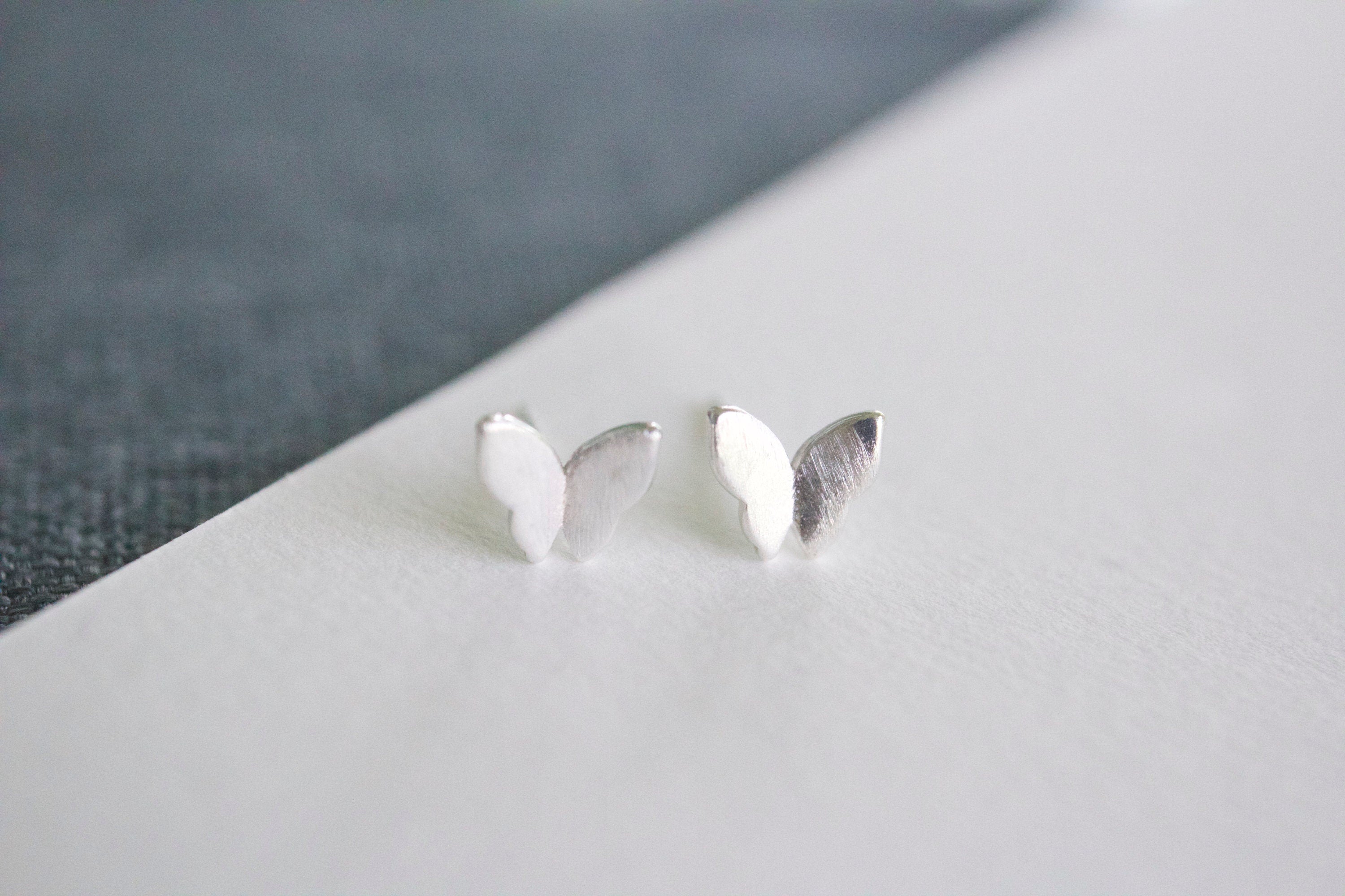 Sterling silver butterfly stud earrings for sensitive ears on white background