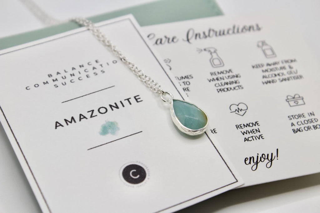 Teardrop-shaped Amazonite necklace on a card with care instructions