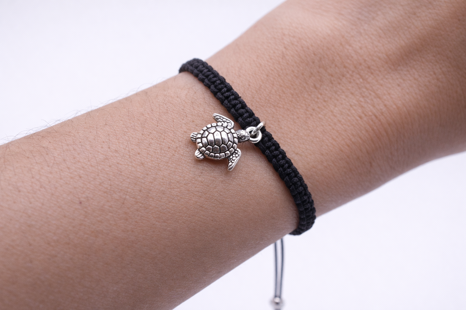 Turtle charm bracelet worn on wrist – adjustable beach jewelry for women