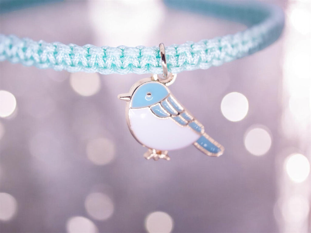 blue friendship bracelet with bird charm, sliding knot adjustable design, handmade boho jewelry