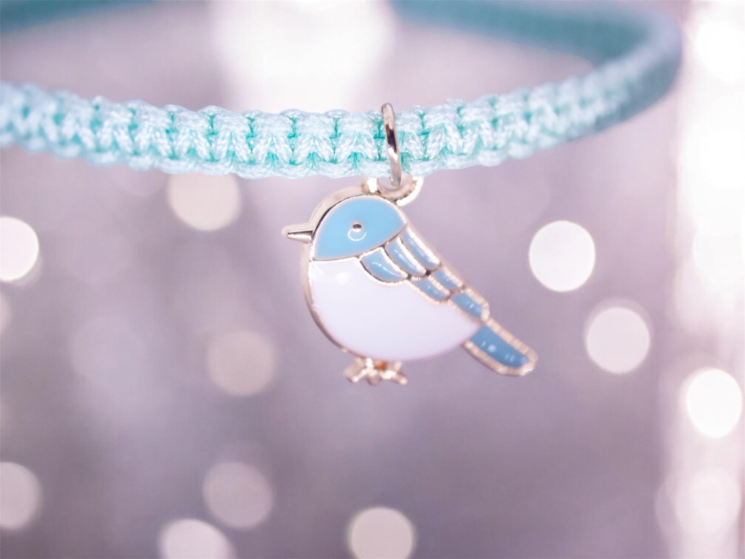 blue friendship bracelet with bird charm, sliding knot adjustable design, handmade boho jewelry