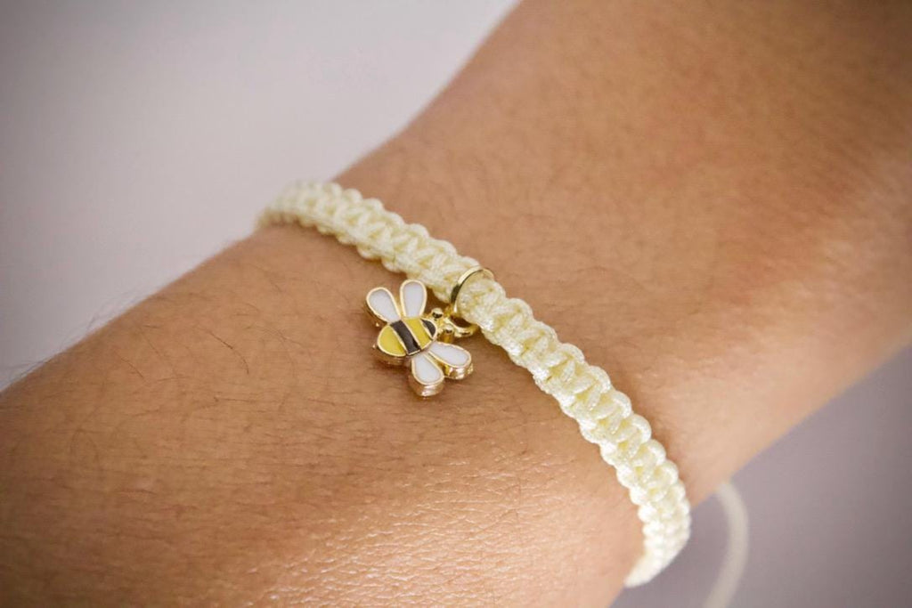 bumblebee macrame friendship bracelet on model wrist