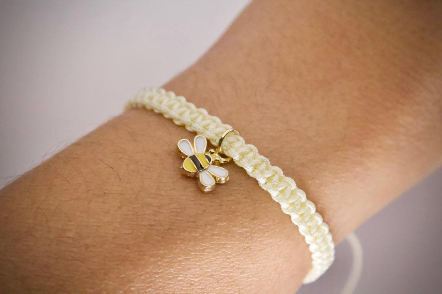 bumblebee macrame friendship bracelet on model wrist