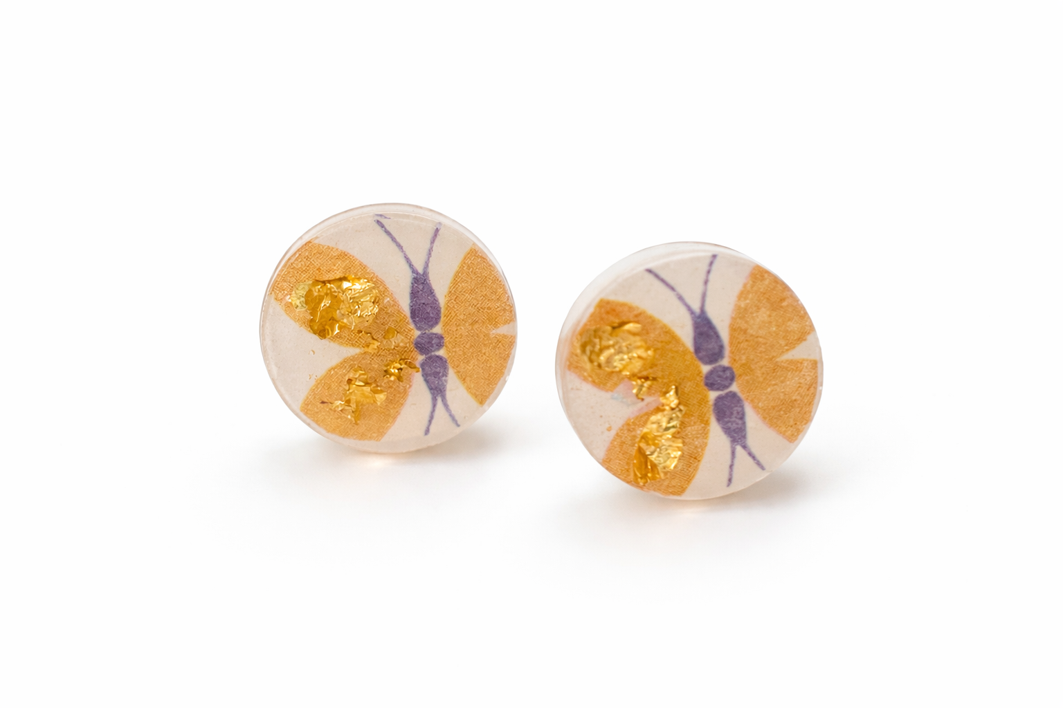 close up of butterfly stud earrings handmade from upcycled paper