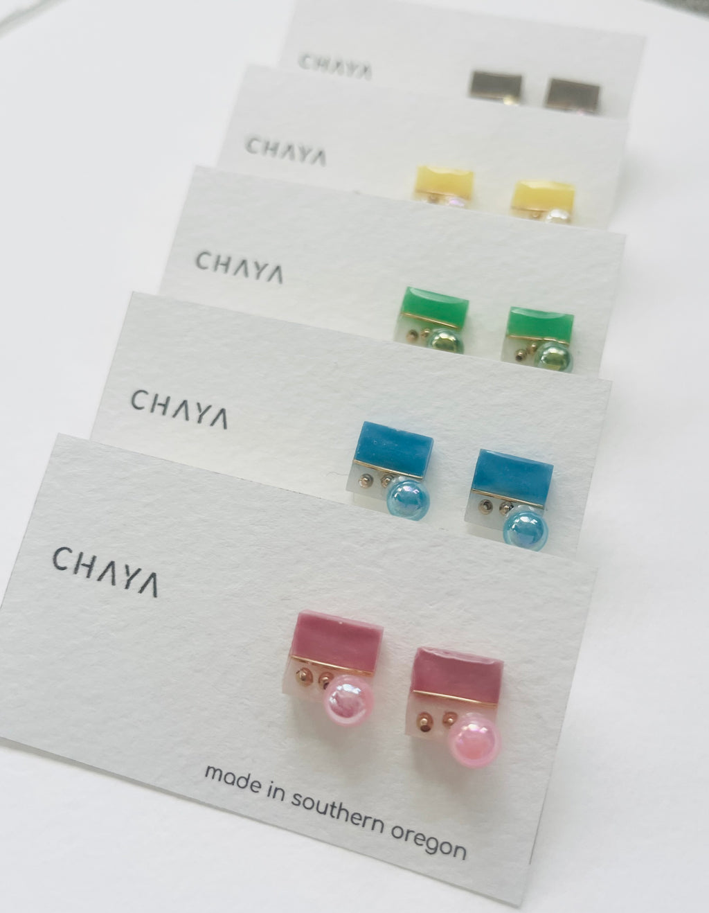 Set of earrings on Chaya branded cards with 'made in southern Oregon' text.