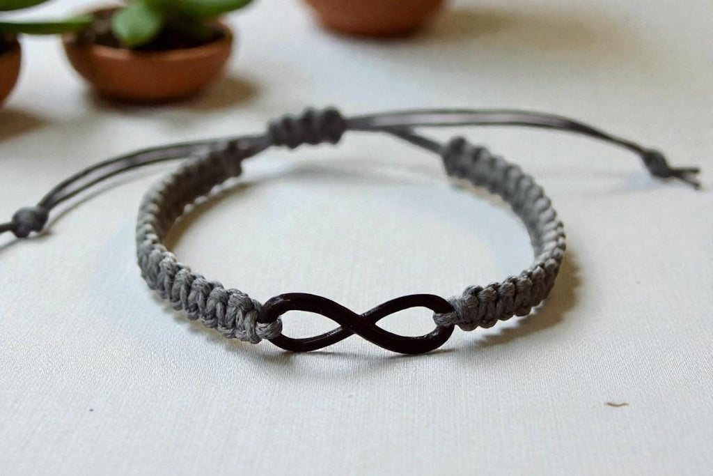 Bracelet with infinity symbol on a light surface