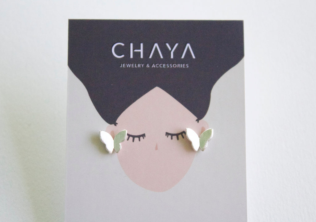 Earrings on a Chaya Jewelry & Accessories card with a face design