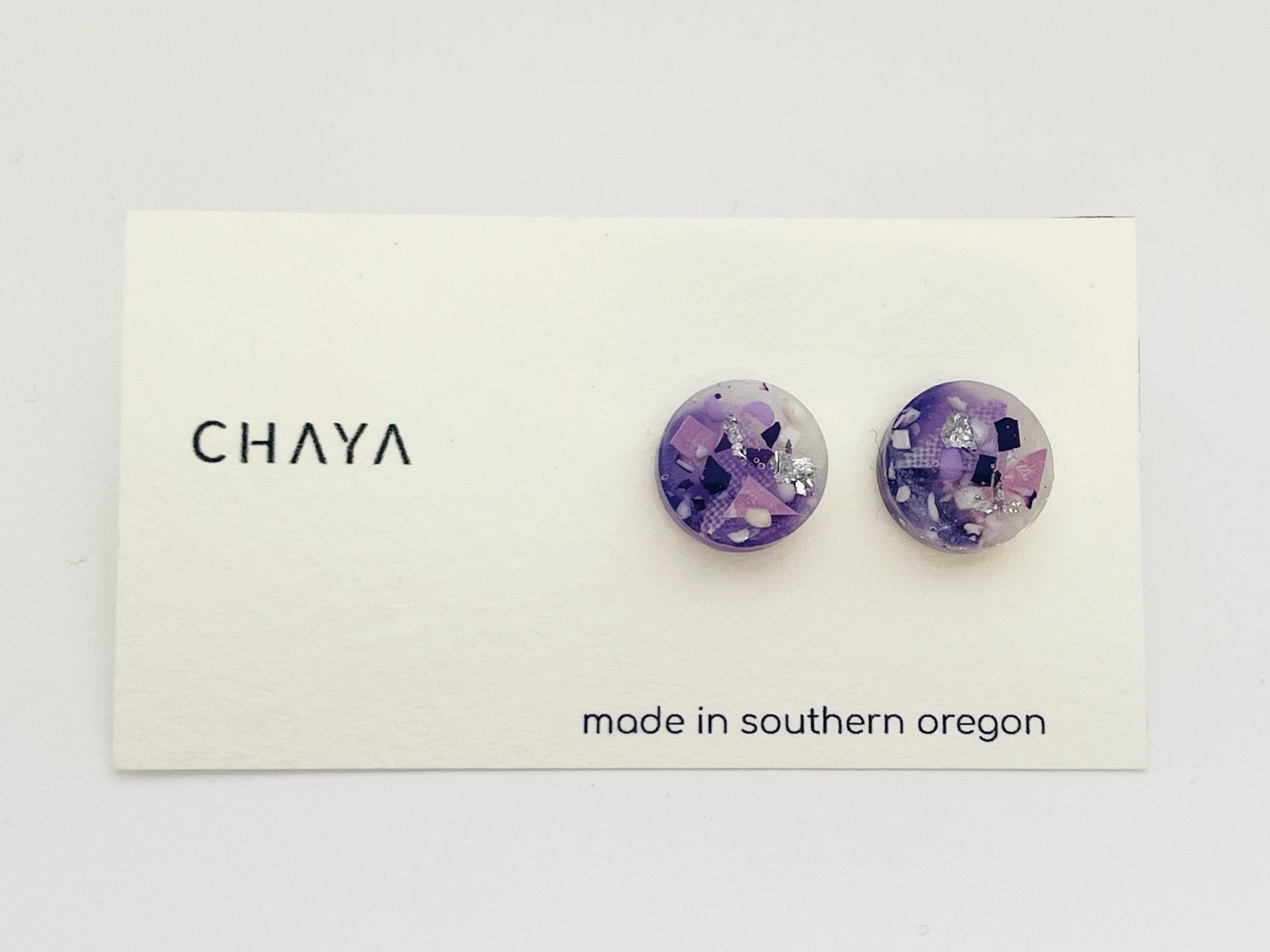 Pair of purple floral earrings on a Chaya branded card with 'made in southern Oregon' text.