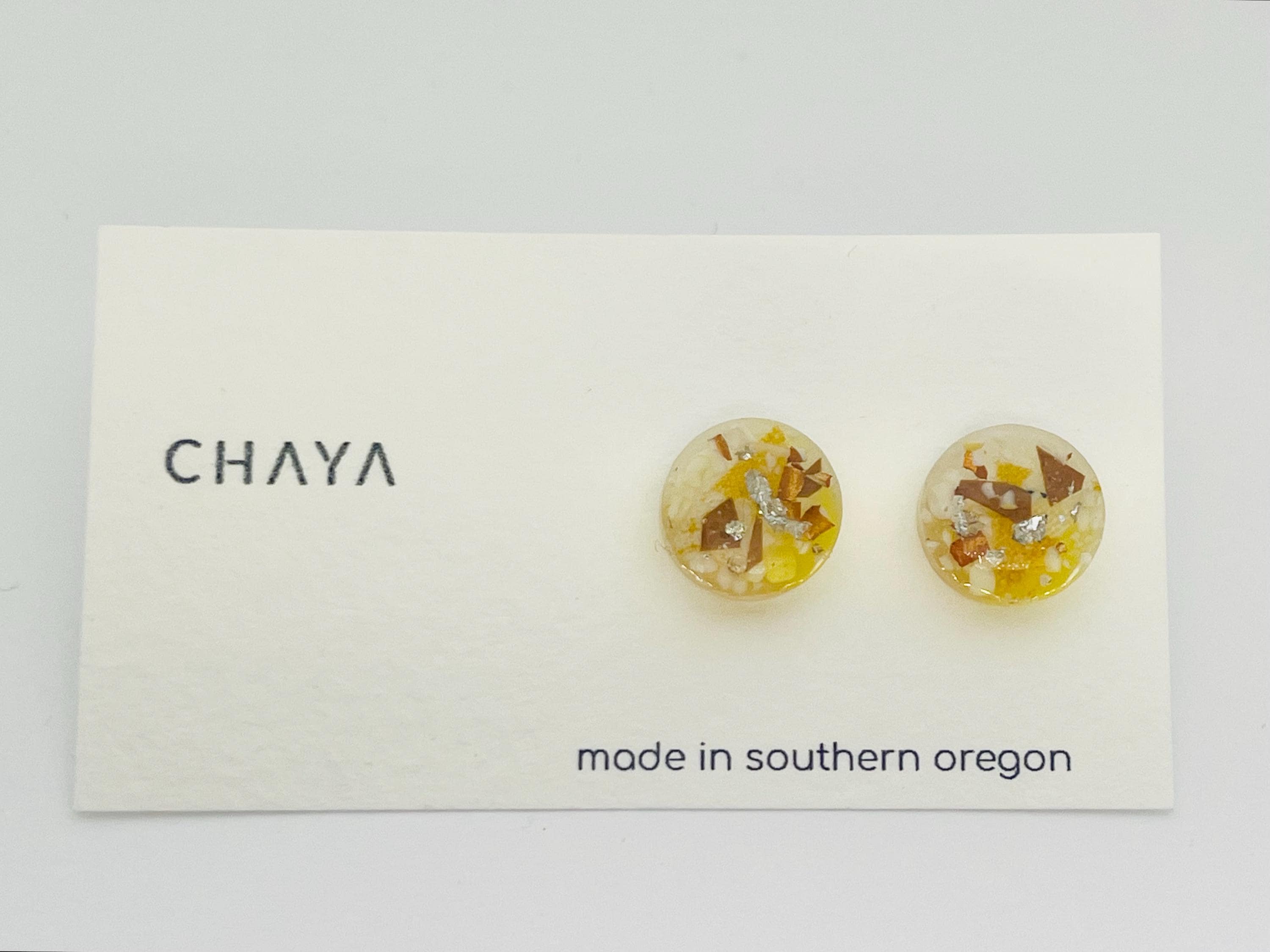 Pair of floral stud earrings on a Chaya branded card with 'made in southern Oregon' text.