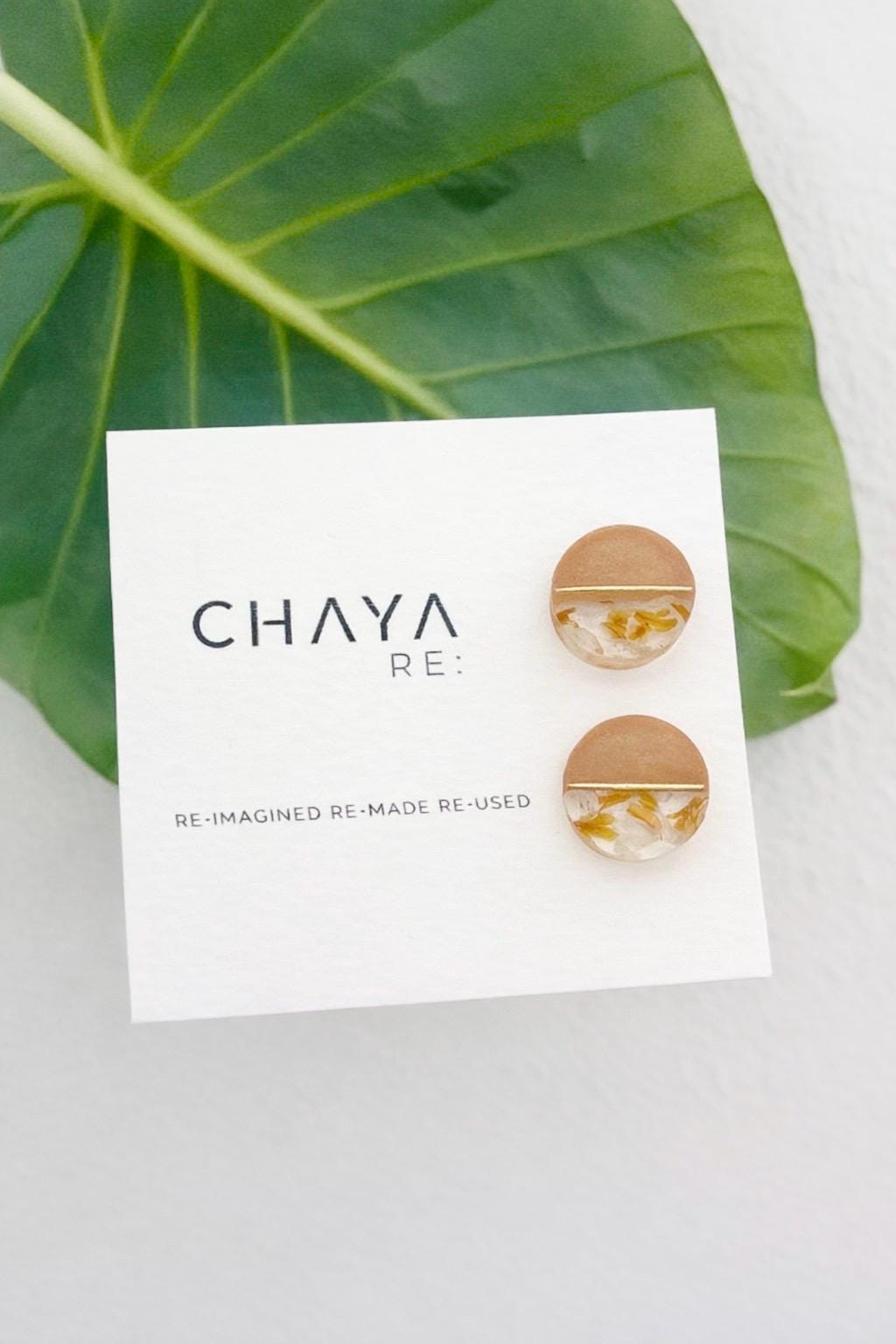 Earring card with 'Chaya' branding and earrings on a white background with a leaf.