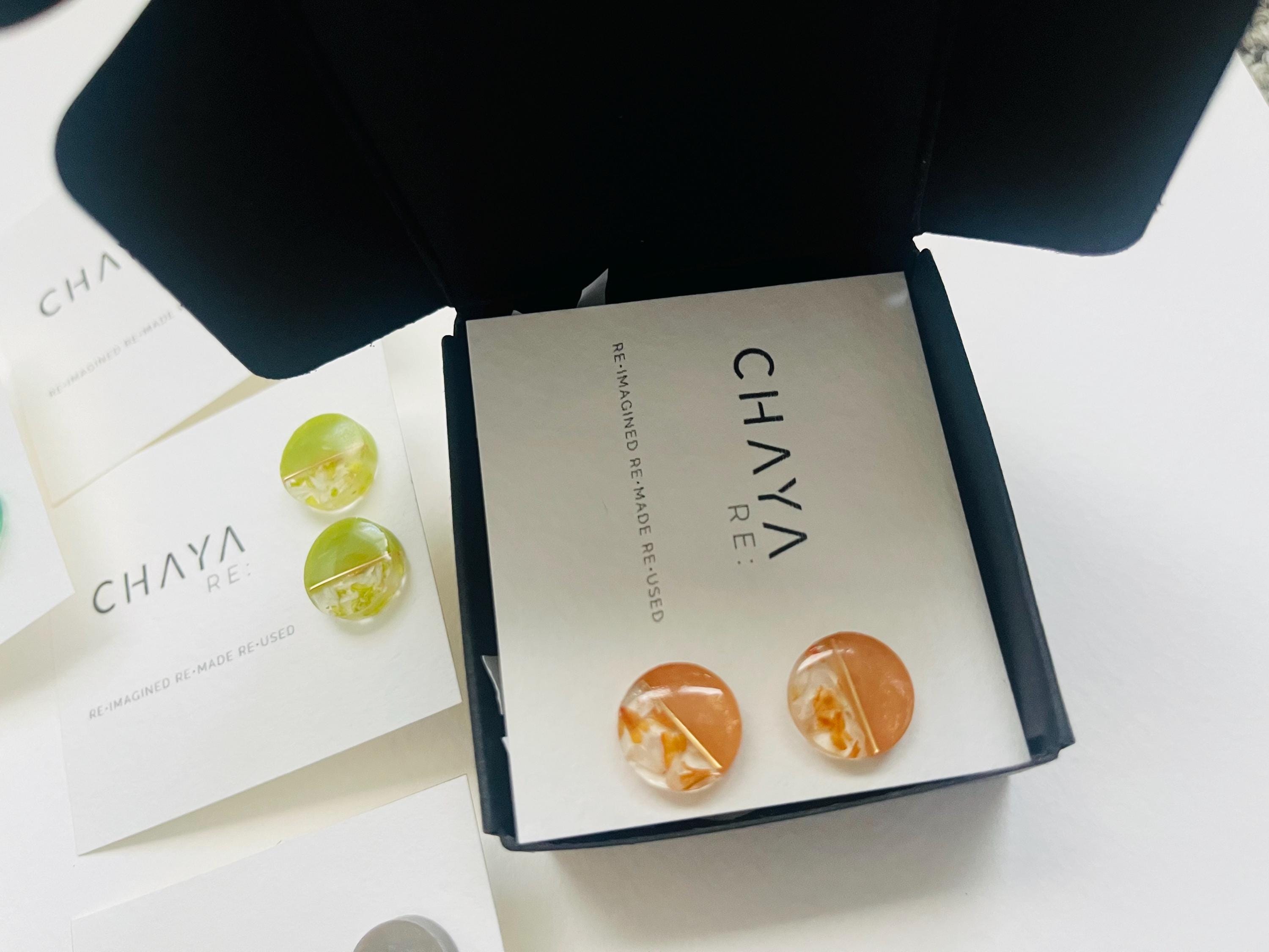 Chaya earrings in a box with a white background