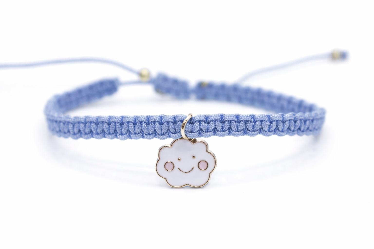 Blue braided bracelet with a cloud charm on a white background